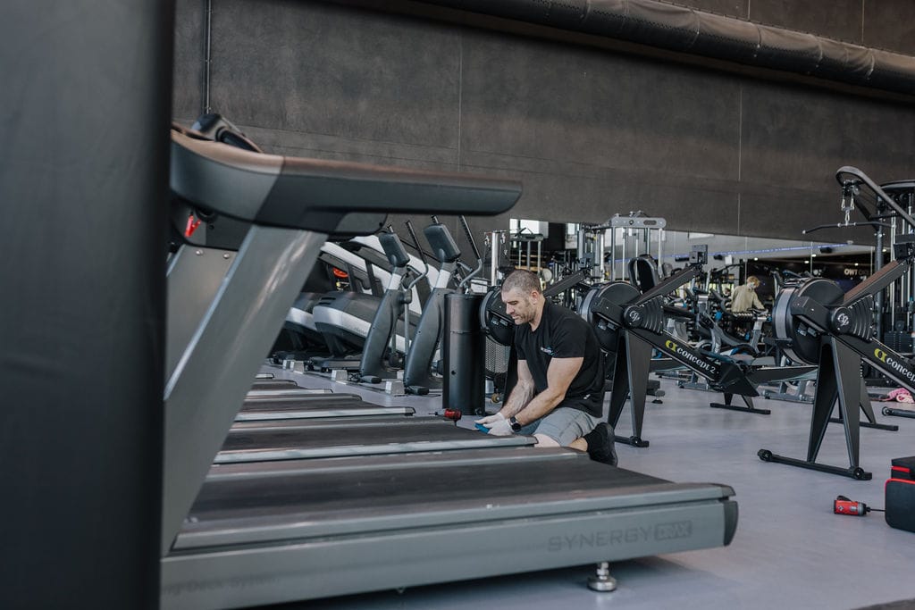 Treadmill Repairs Brisbane technician servicing treadmill