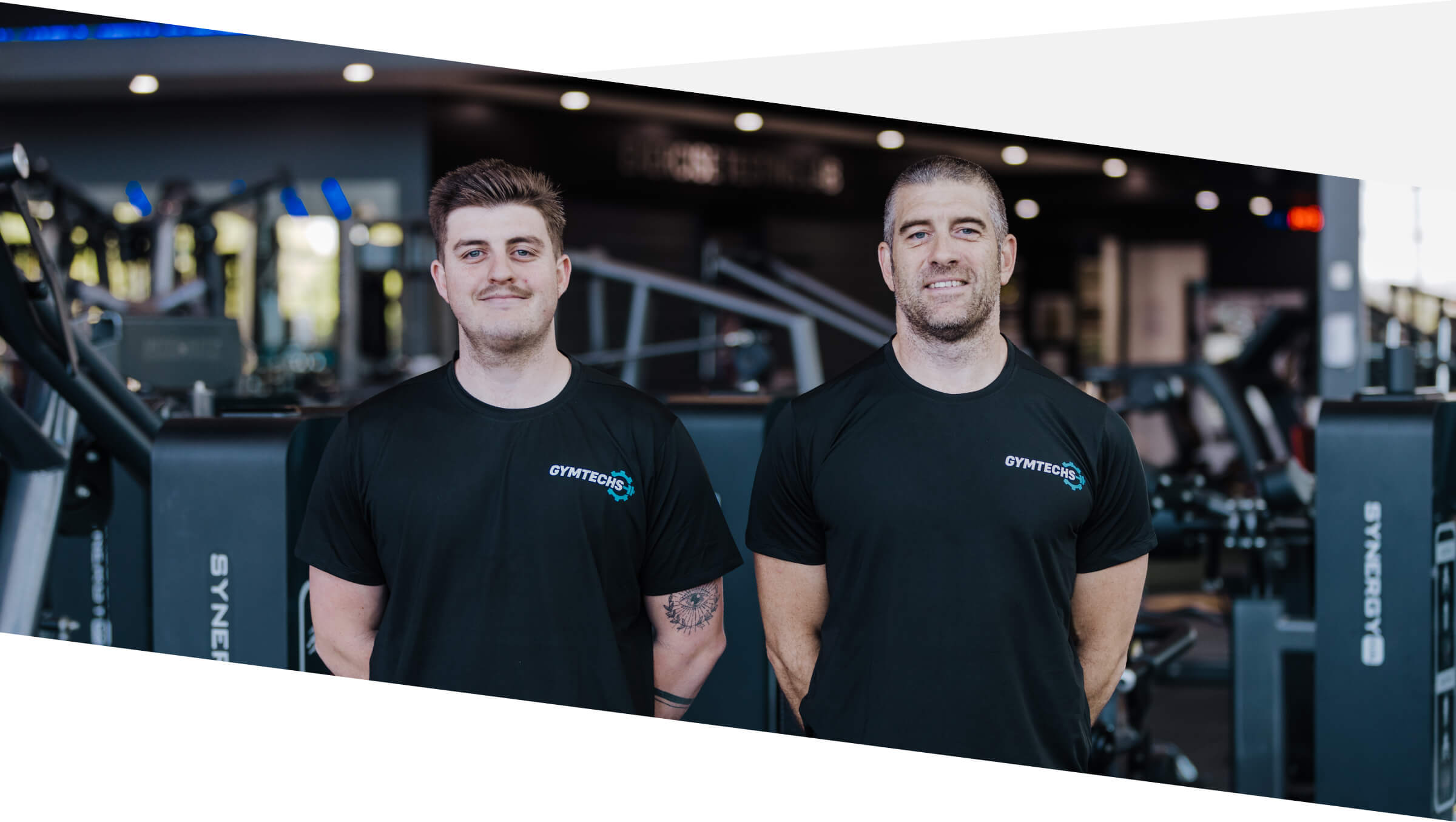Two Gymtechs fitness equipment technicians